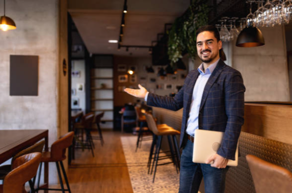 A franchise host welcoming guests into a new Baba's Restro & Bar location